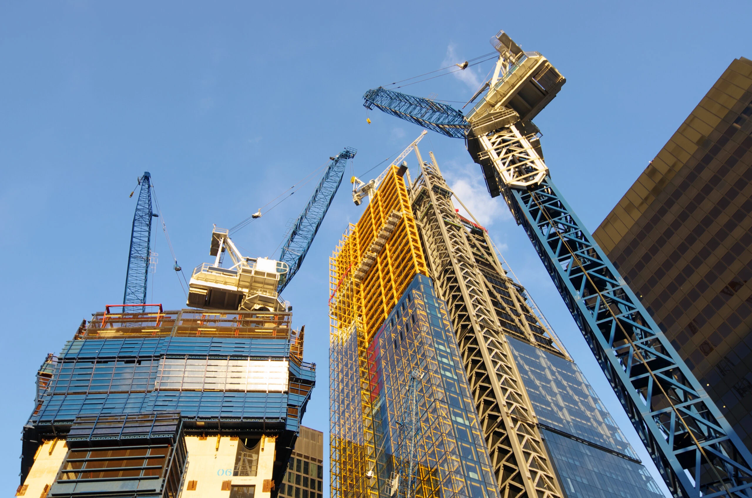 low view of the cranes to build new skyscrapers in the City of London