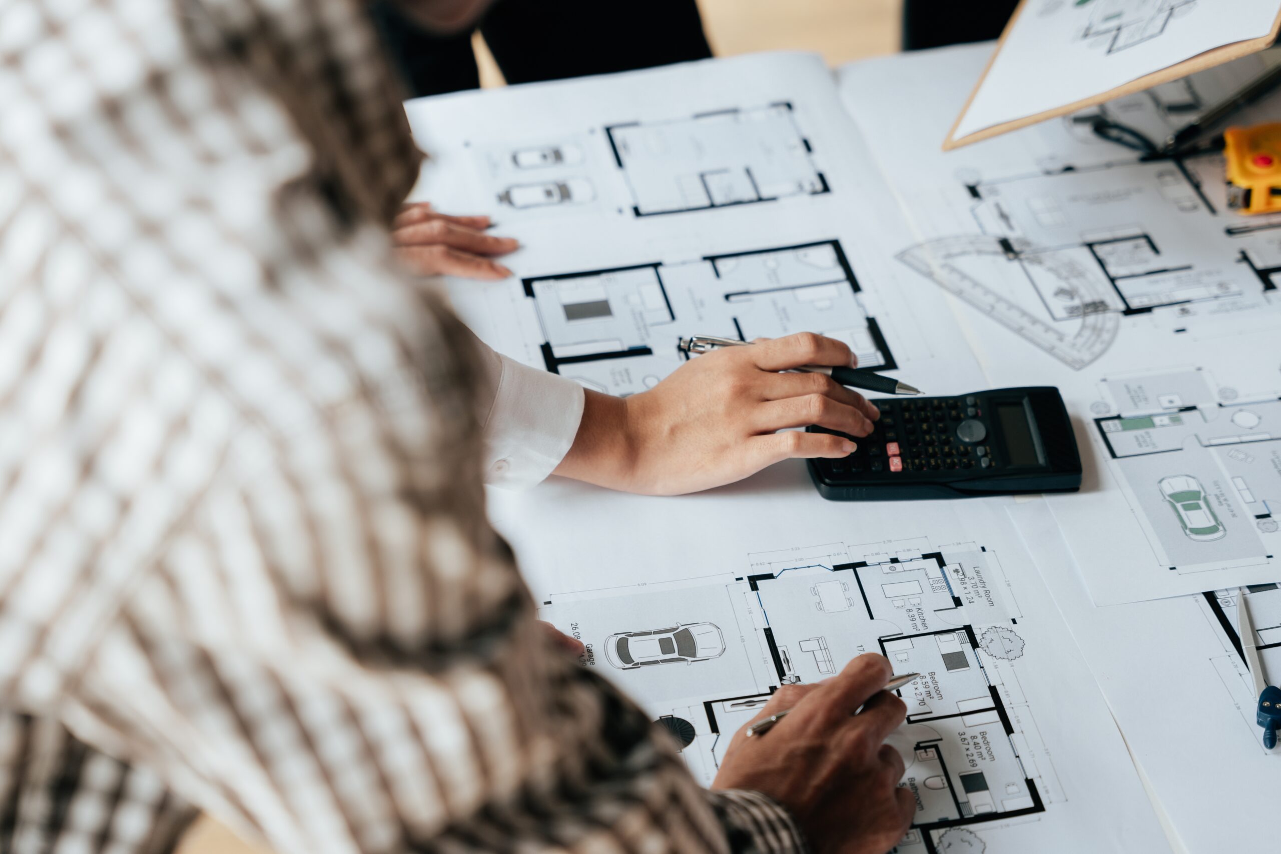 People looking over architecture diagrams