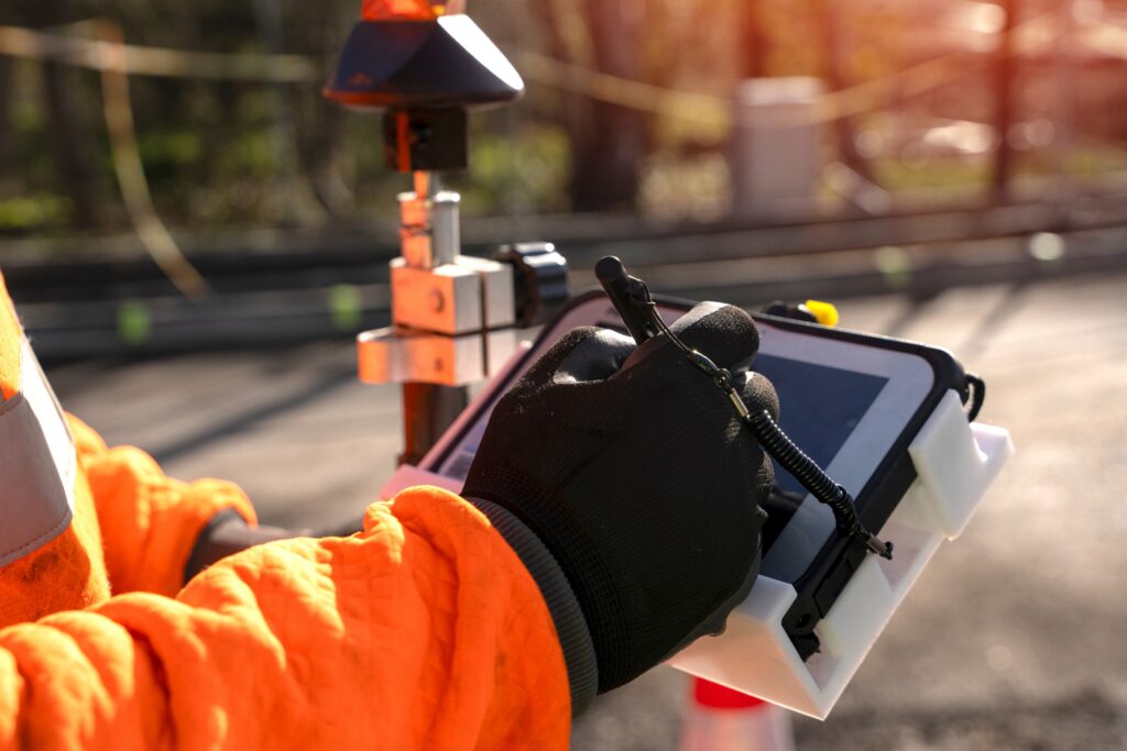 Surveyor taking notes on construction site