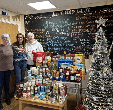 Checkmate member of staff at a food bank.